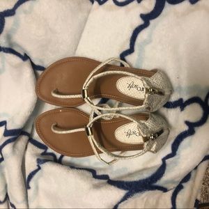 White patterned sandals with gold detail